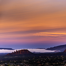 Sedona Airport Scenic Overlook at Sunrise with the mountains in the mist.